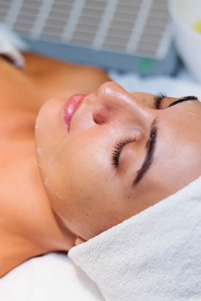 young-woman-lying-cosmetologist-s-table-during-rejuvenation-procedure-chemical-peel